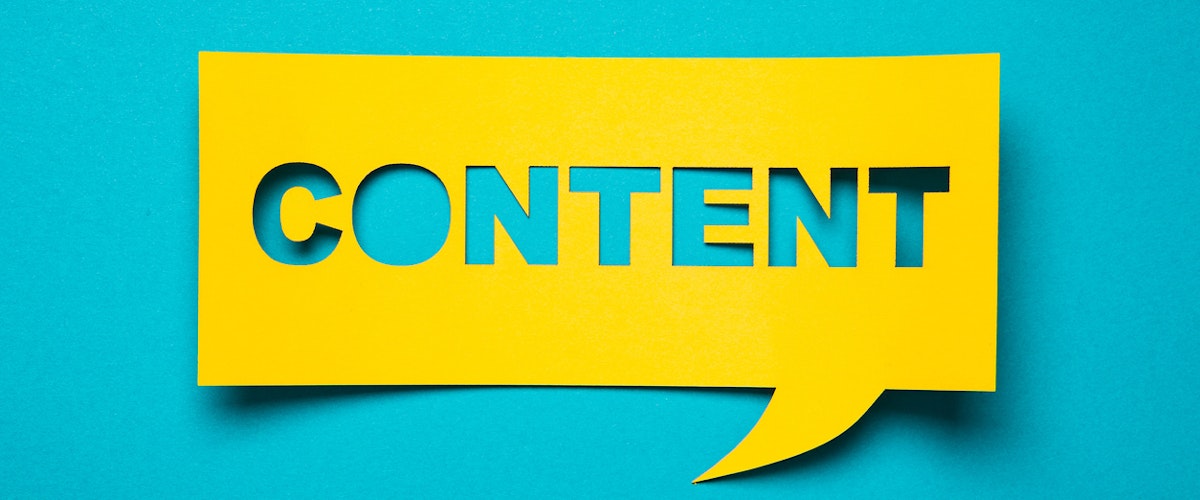 A paper speech bubble with the word "content" cut out